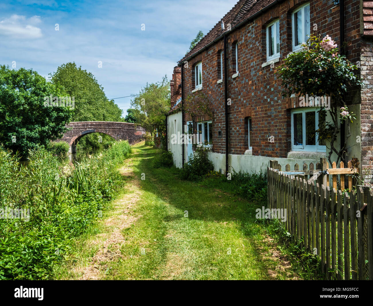 A pretty brick cottage along the Kennet and Avon Canal in Wiltshire. Stock Photo