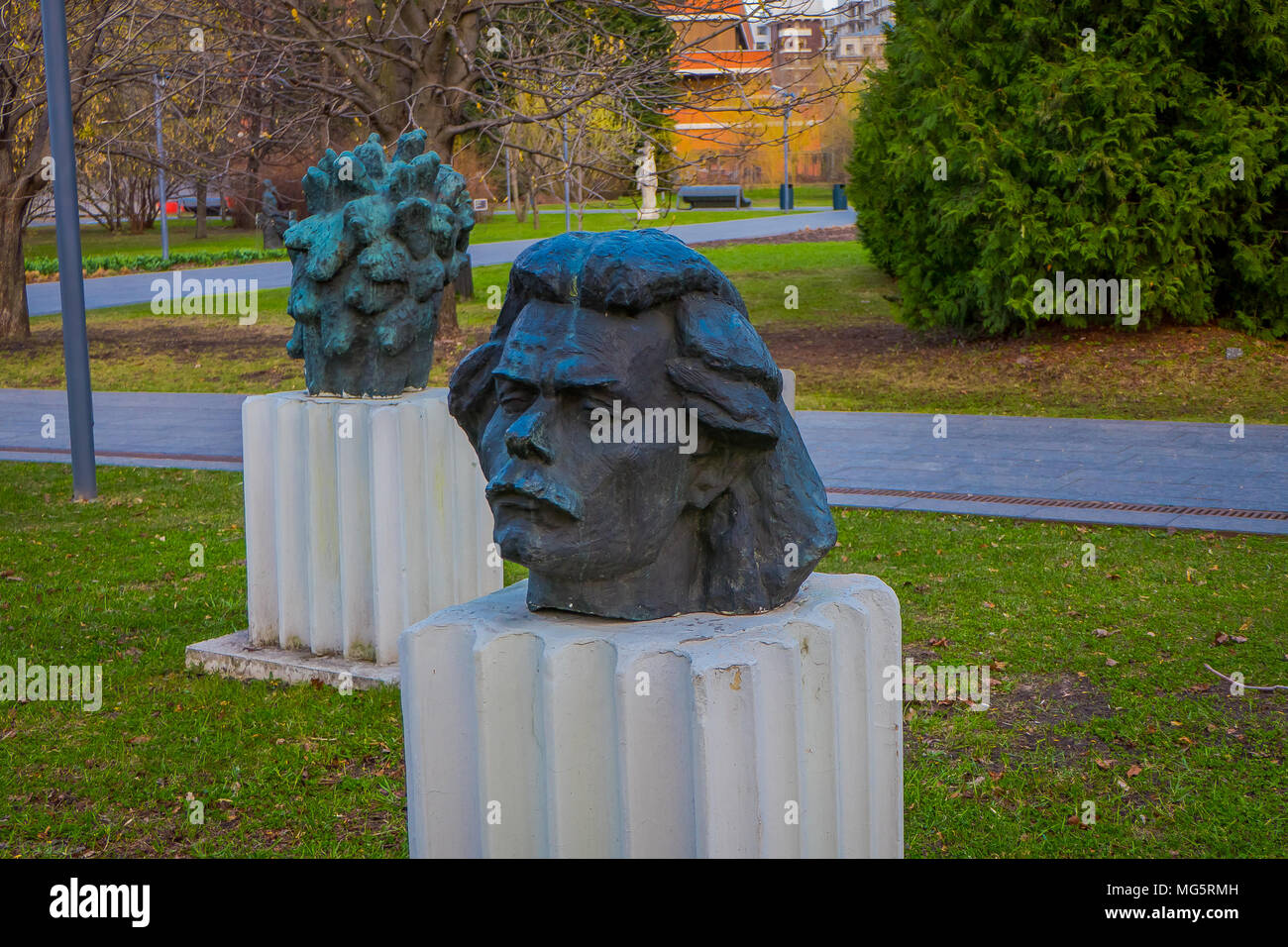 MOSCOW, RUSSIA- APRIL, 24, 2018: View of modern head sculptures in fallen Monument Park also known as Muzeon Park of Arts with relics of the Soviet Union USSR  Stock Photo
