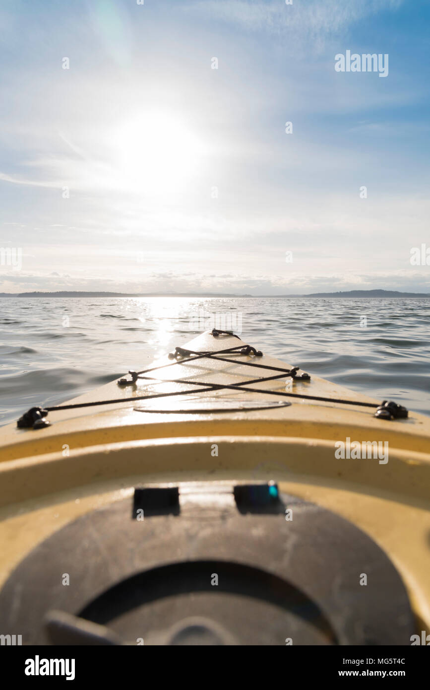 Point of view kayak at dusk on beautiful Puget Sound near Seattle vertical nose of boat. Stock Photo