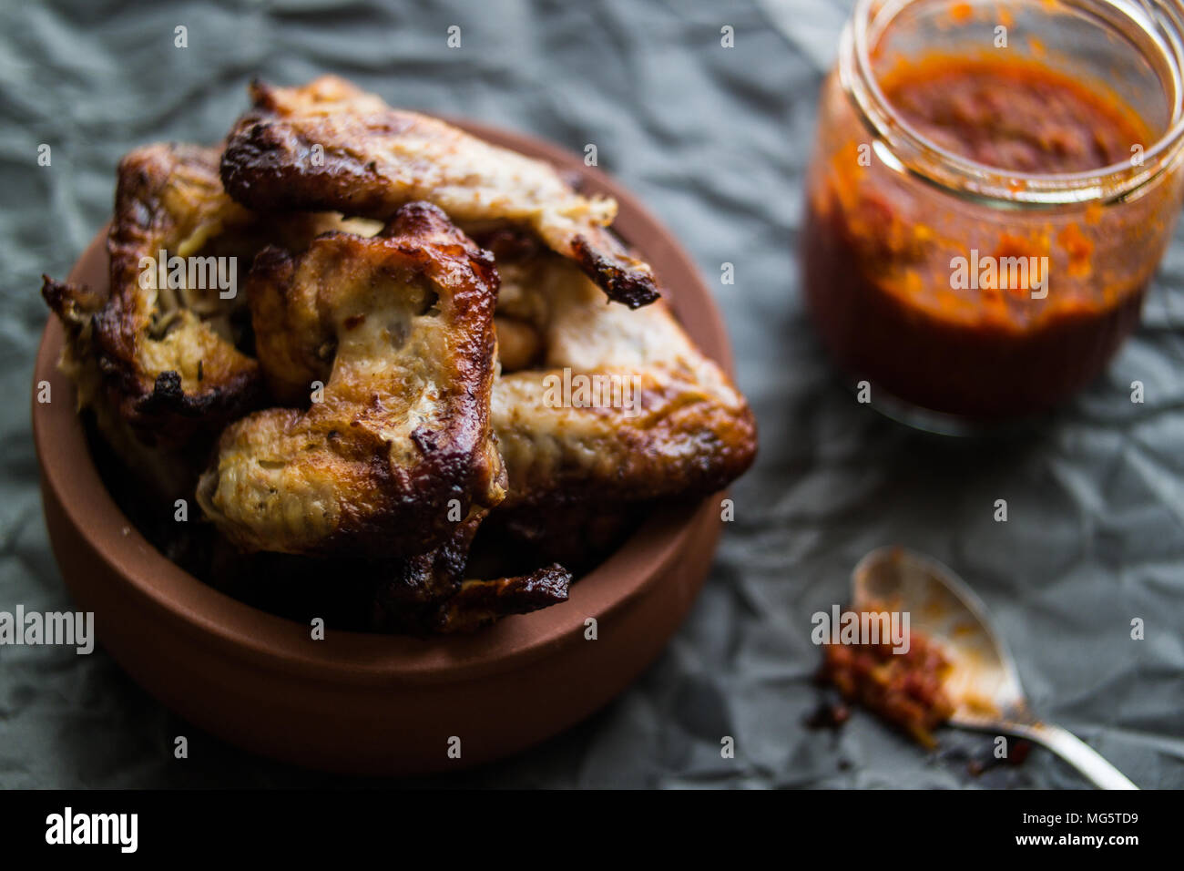 A type of food, a serving of the wing sections of a chicken, deep fried