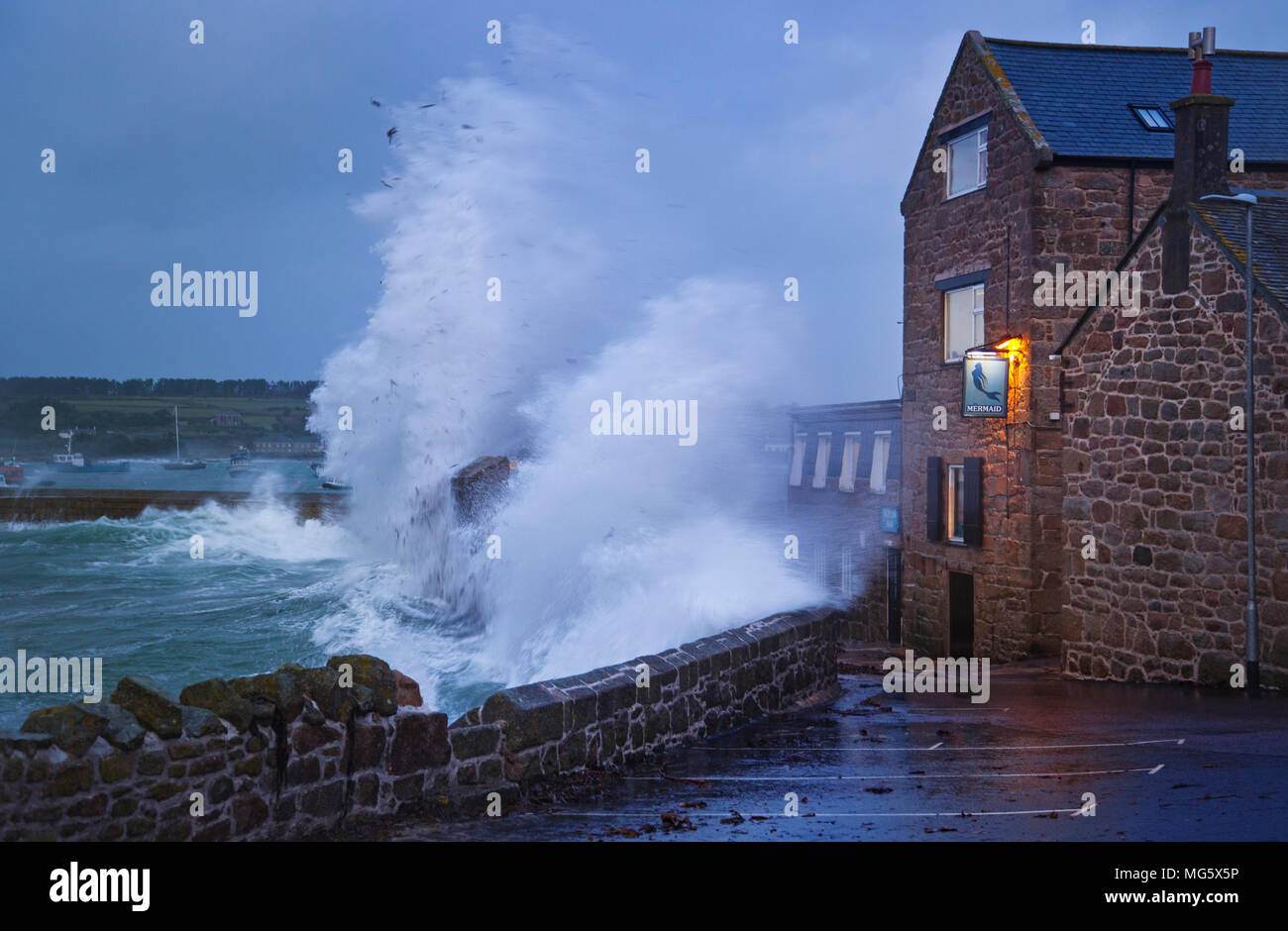 Waves crashing over the Mermaid inn in St Marys on the Isles of Scilly,UK Stock Photo
