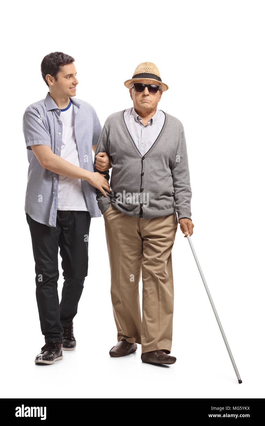Full length portrait of a mature man walking with the help of a young ...