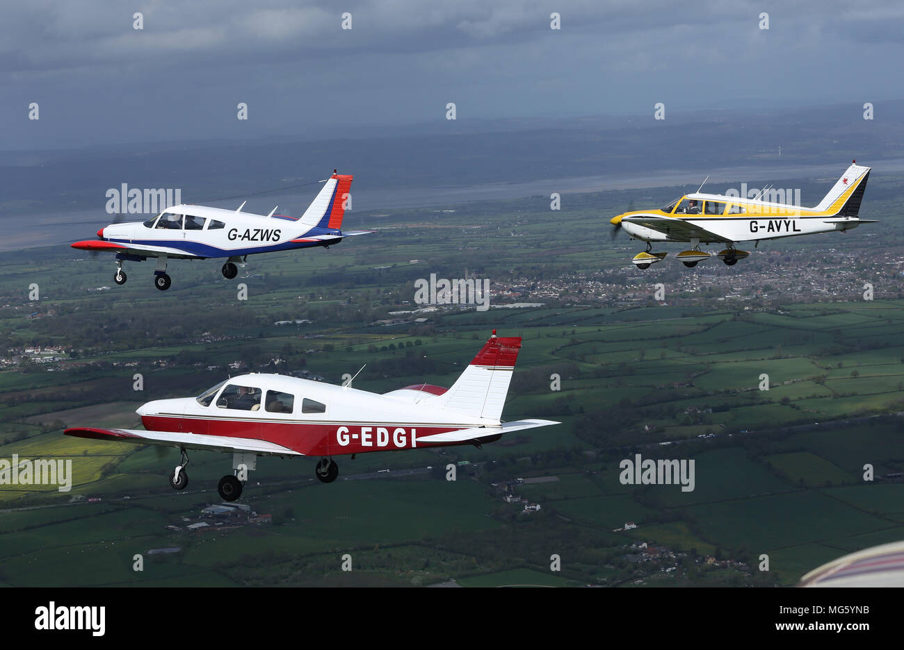 Three Piper aircraft of Lyneham Flying Club, flown by former and current RAF personnel practising for the RAF Centenary Baton Relay on May 1st Stock Photo