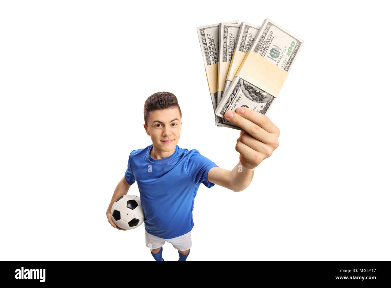 Teenage soccer player with bundles of money isolated on white