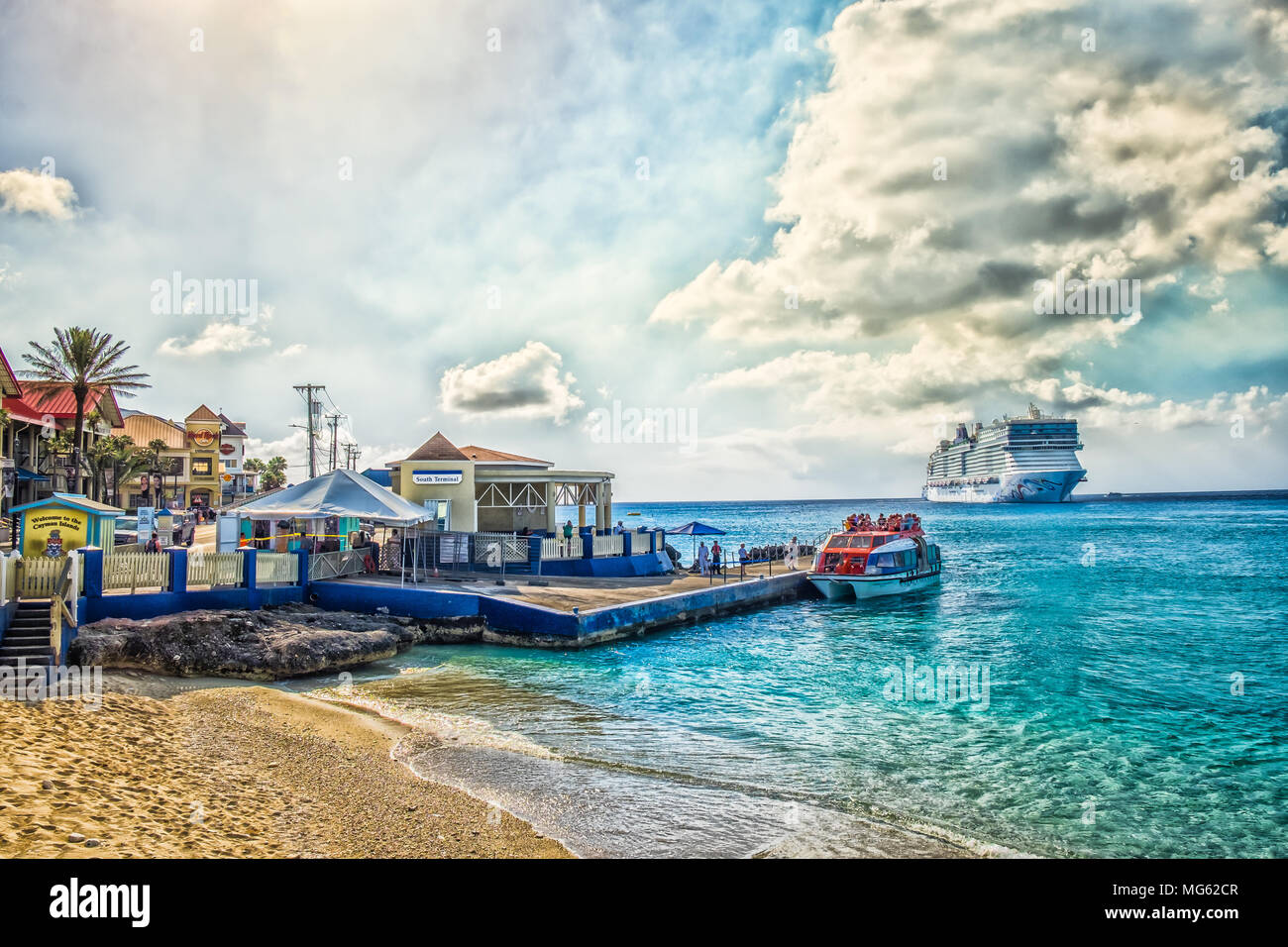 George Town Grand Cayman Feb 2018 Port With A Cruise Ship Leaving And Tourists Embarking On A Marine Shuttle Stock Photo Alamy