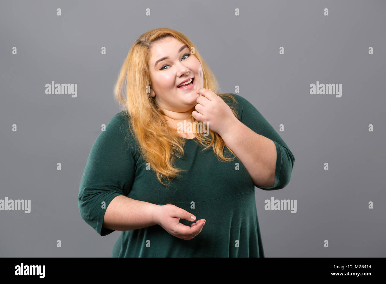 Pleasant obese woman looking at you Stock Photo
