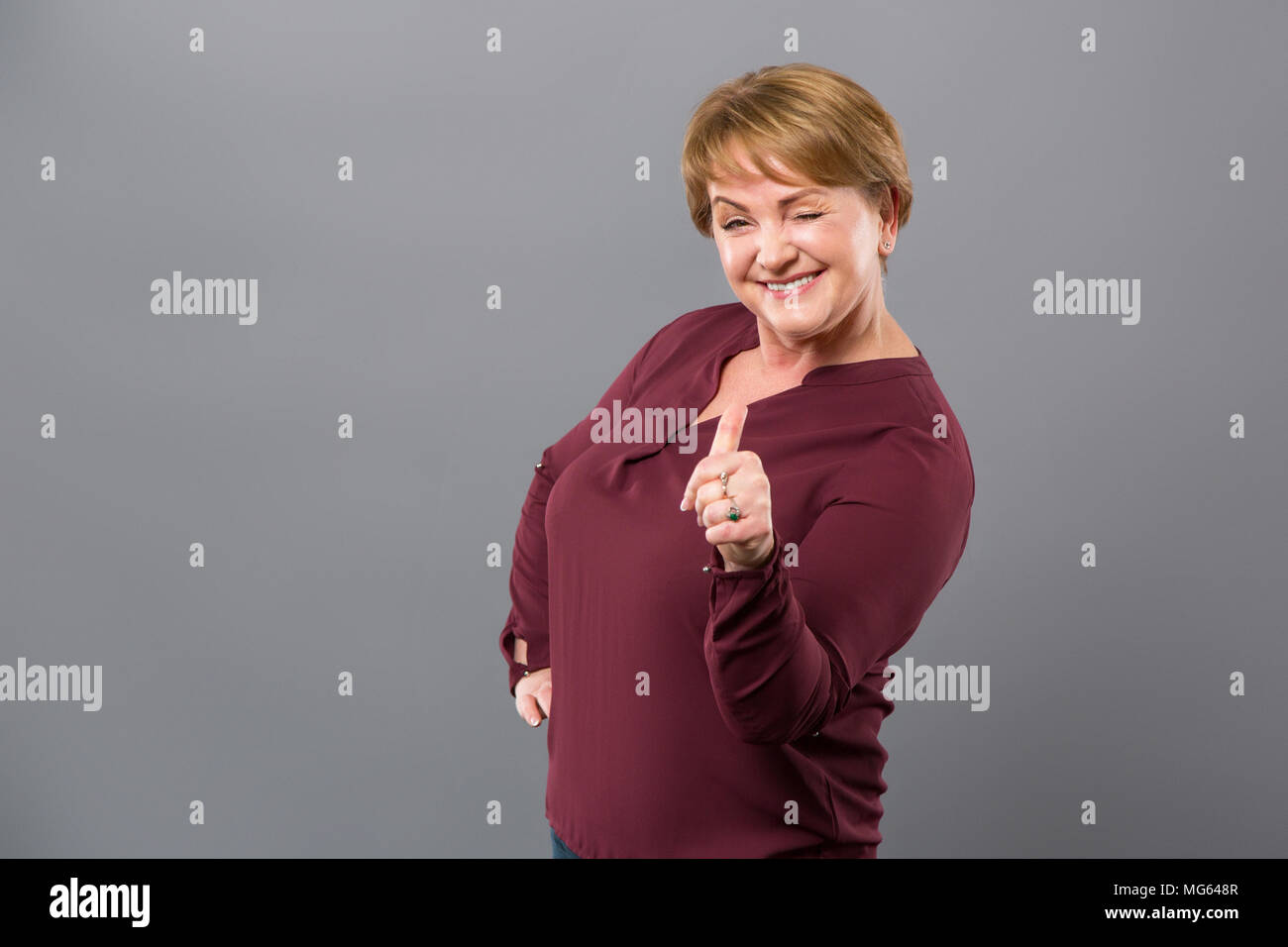 Cheerful adult woman being in a great mood Stock Photo