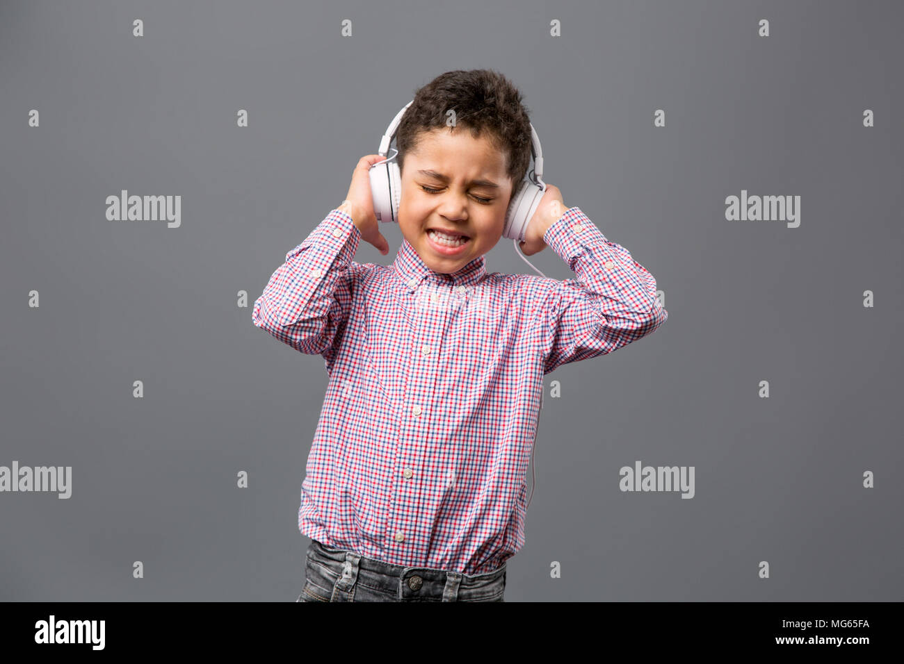 Happy nice boy listening to music Stock Photo - Alamy