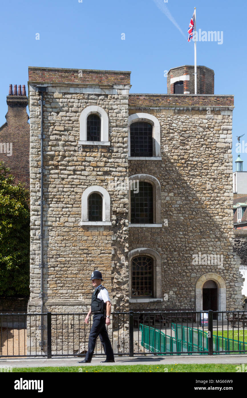 London, United Kingdom - April 23, 2015: A British Bobby, police officer walks past the Jewel Tower opposite the Palace of Westminster Stock Photo