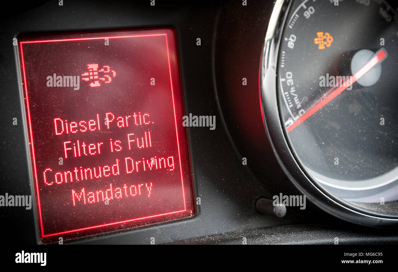 Diesel particulate filter warning light on a car dashboard Stock Photo