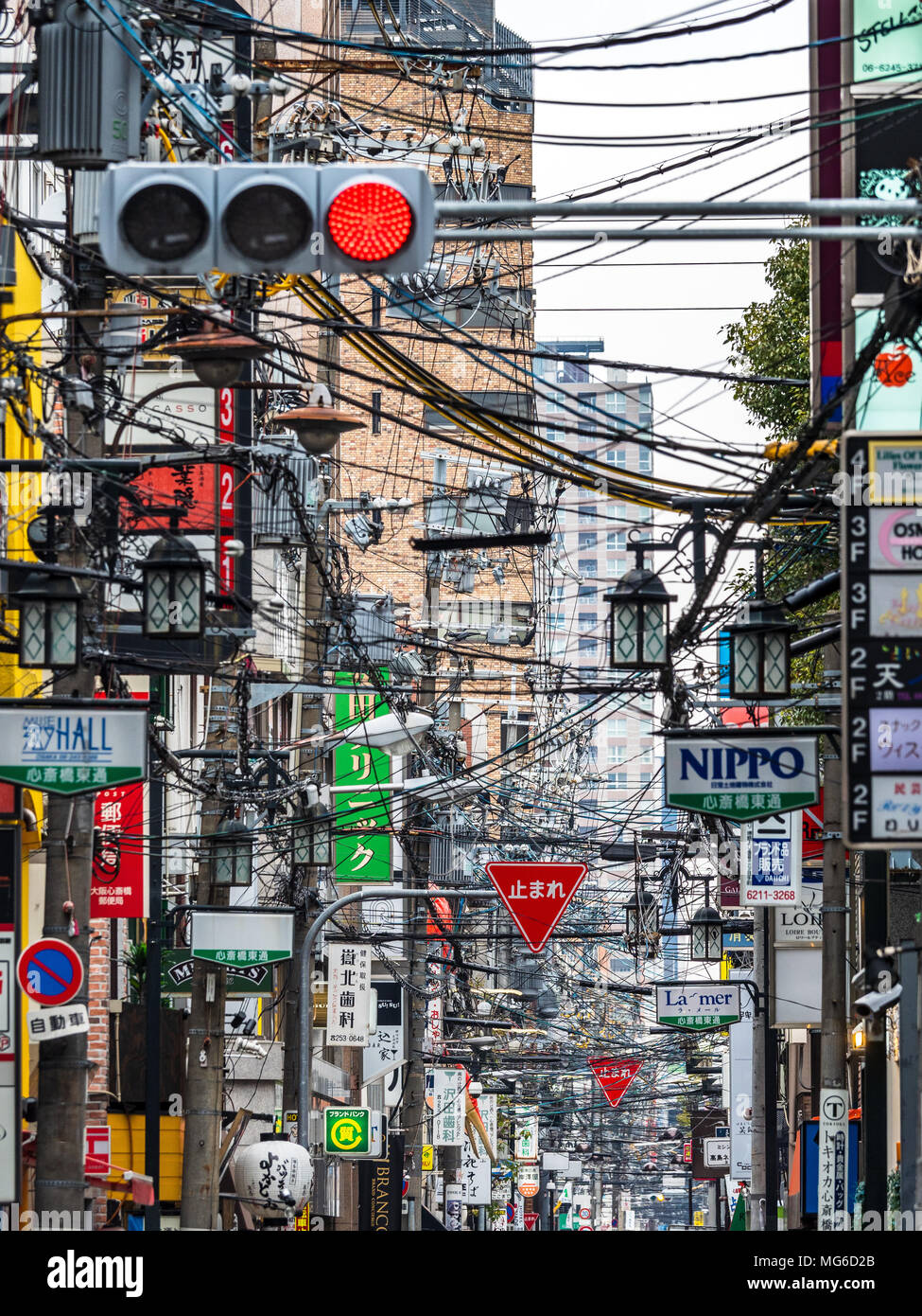 Japan Osaka Congested overhead cables in a street in Osaka Japan. Unlike most advanced nations the majority of Japan’s power grid remains above ground. Stock Photo