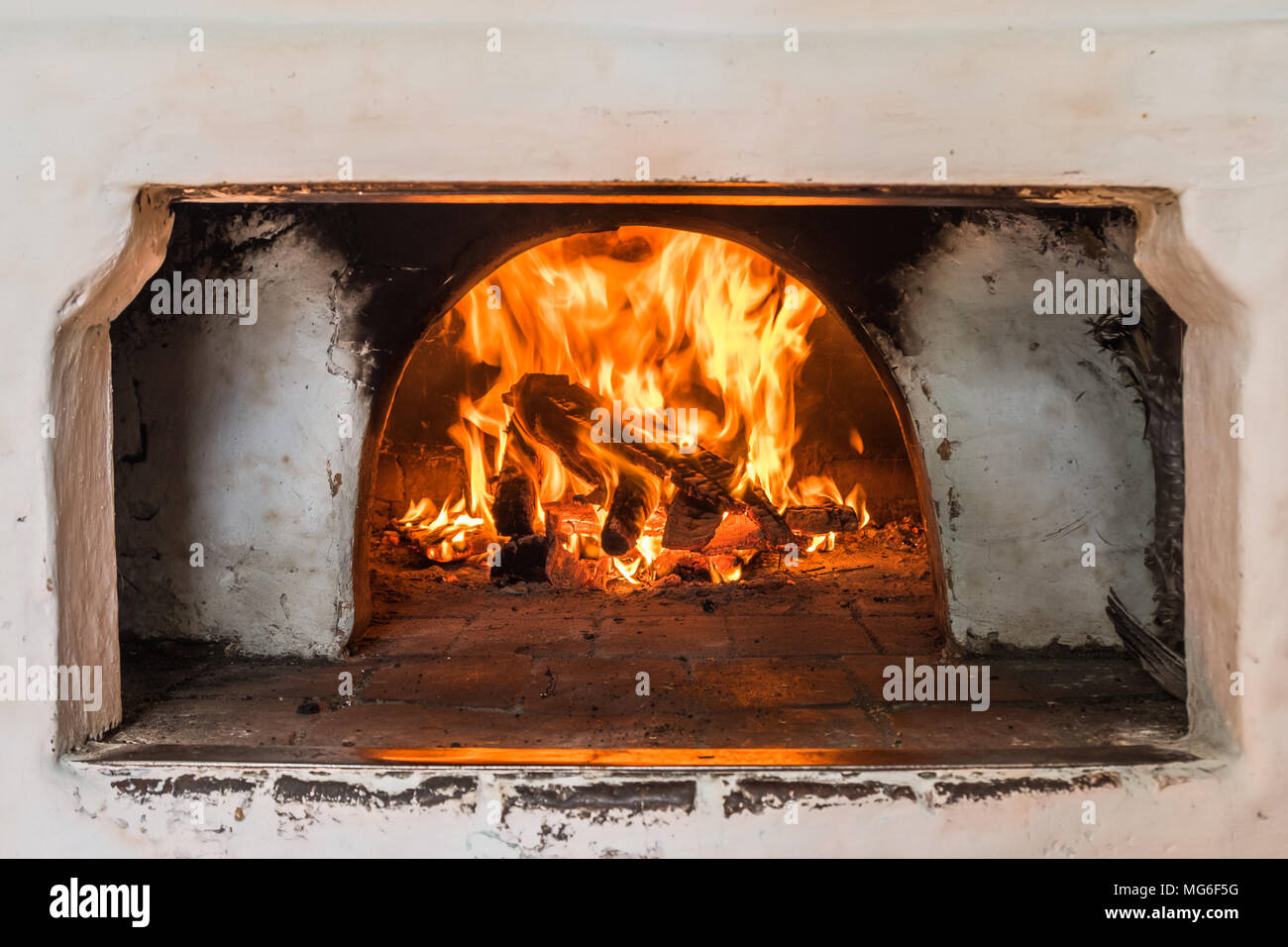 Russian Oven Painted White With Dirty Smoked Spots Burning Wood