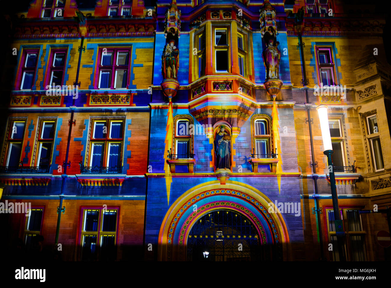 Coloured lights illuminate building of Gonville and Caius College as part of festival of light Stock Photo