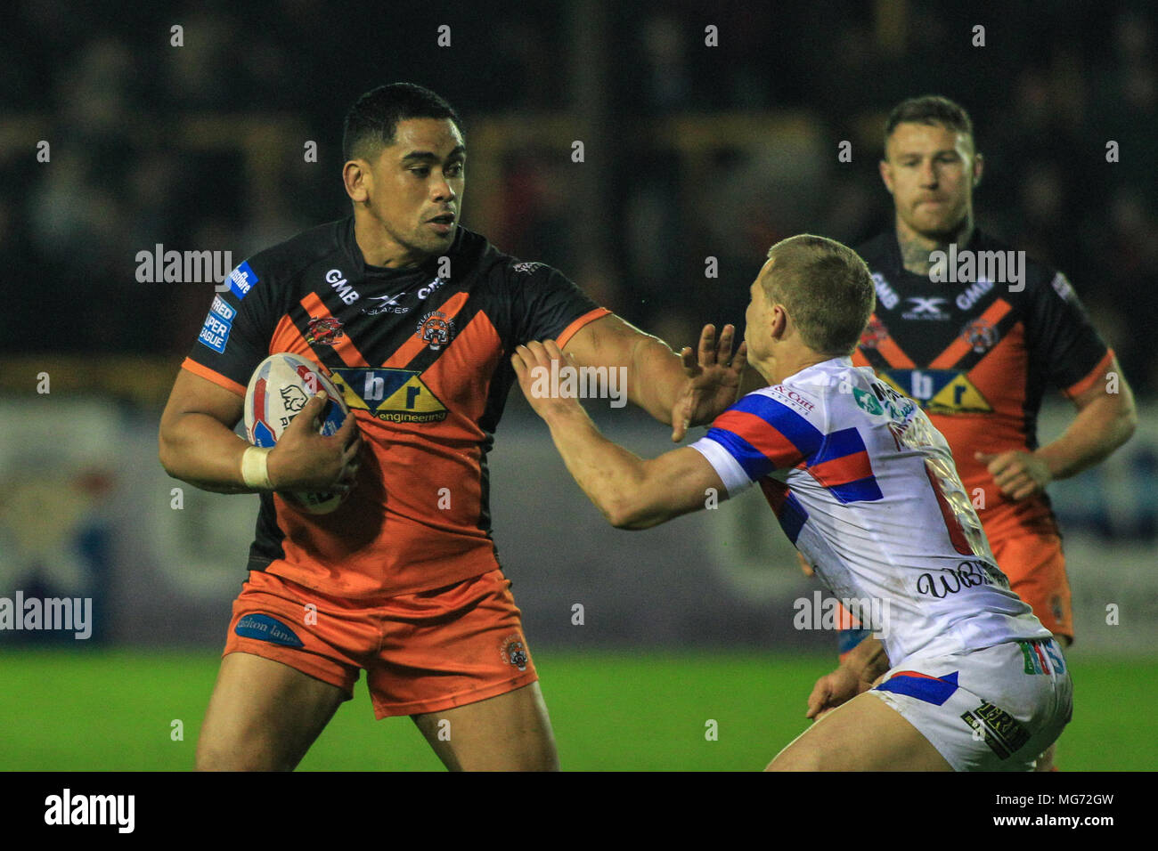 Castleford, UK. 27th April 2018 , Mend-A-Hose Jungle, Castleford, England; Betfred Super League rugby, Castleford Tigers v Wakefield Trinity;Junior Moors of Castleford Tigers hands off Jacob Miller of Wakefield Trinity Credit: News Images /Alamy Live News Stock Photo
