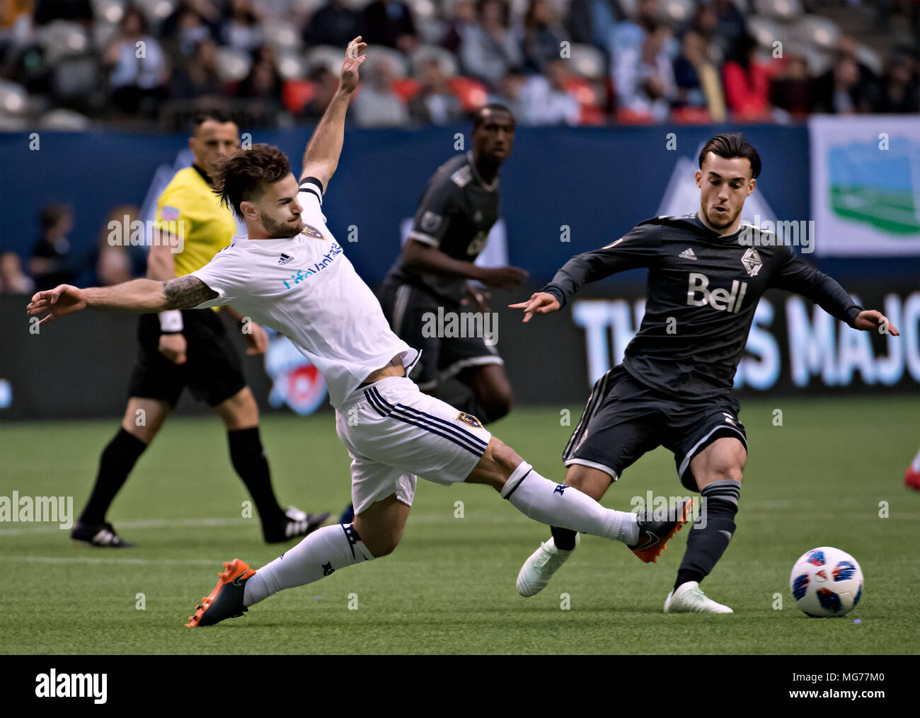 Vancouver, Canada. 27th Apr, 2018. Real Salt Lake's Kyle Beckerman (L) vies with Vancouver Whitecaps' Russell Tiebert during the Major League Soccer (MLS) regular season soccer match between Vancouver Whitecaps and Real Salt Lake in Vancouver, Canada, on April 27, 2018. Credit: Andrew Soong/Xinhua/Alamy Live News Stock Photo
