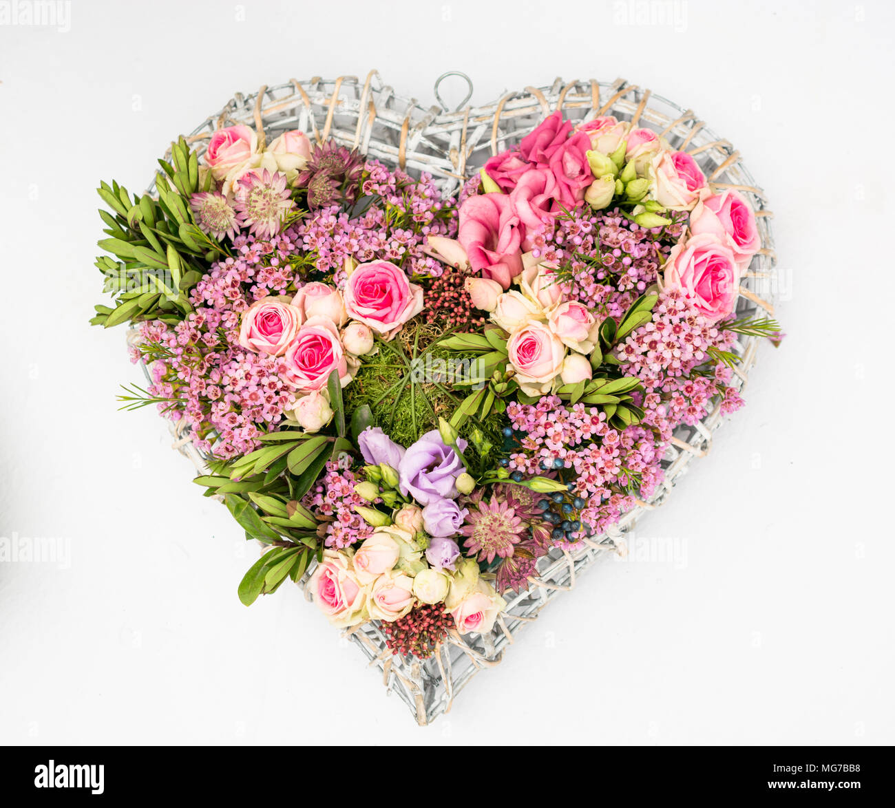 Heart of flowers on a white background Stock Photo - Alamy