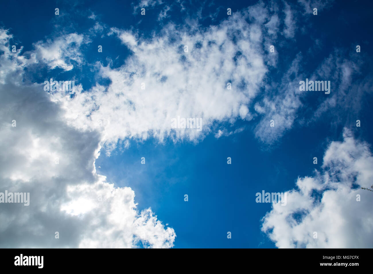 Bright blue Sky with some clouds Stock Photo - Alamy