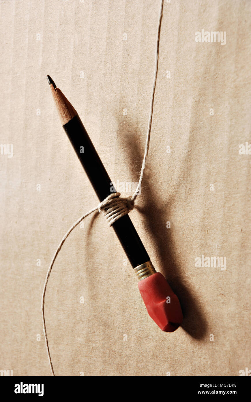 pencil hanging from string Stock Photo Alamy