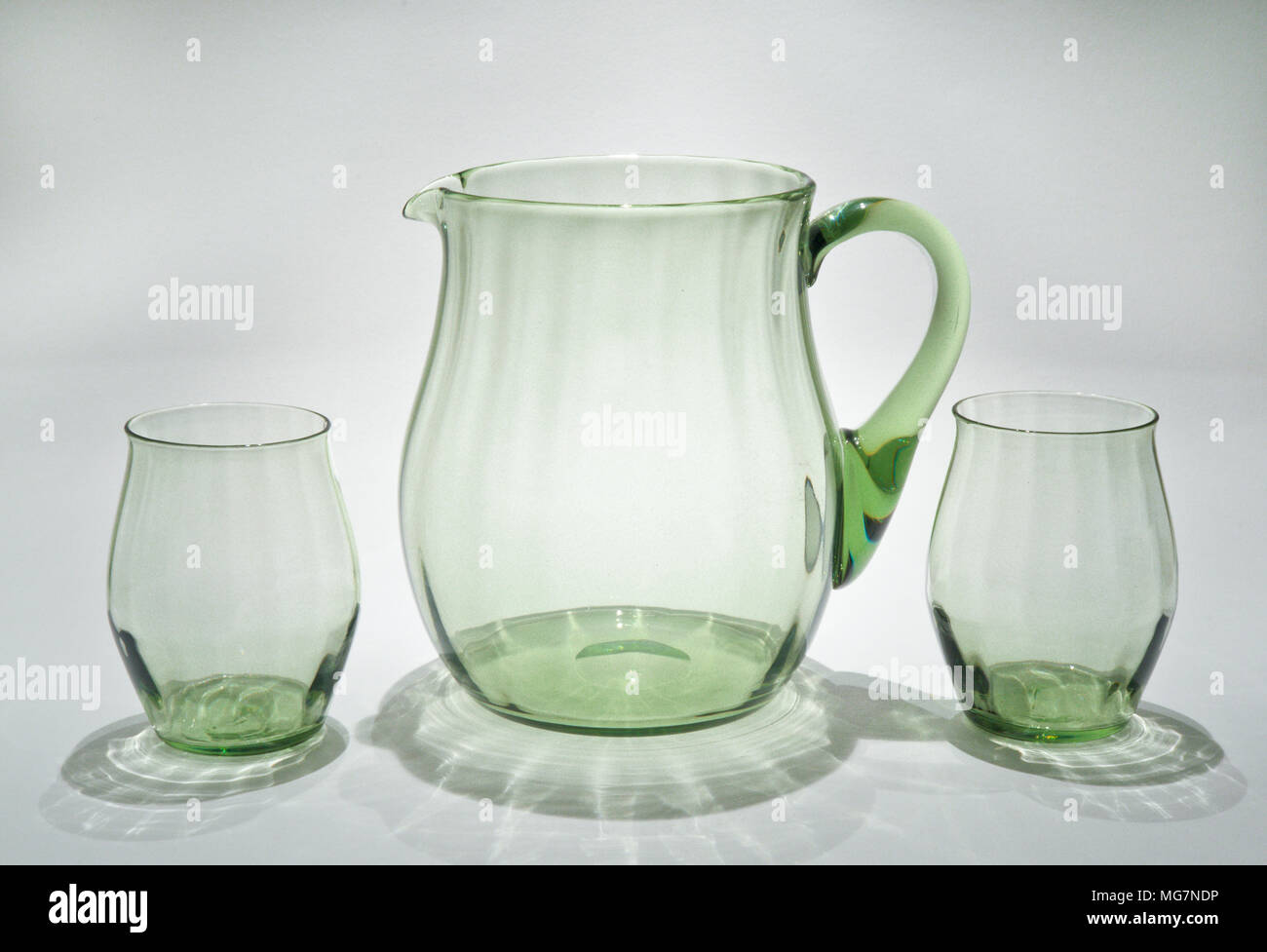 Whitefriars Glass Pattern M2 Ribbed Water Set in Sea Green designed by James Hogan in 1933. London, UK Stock Photo