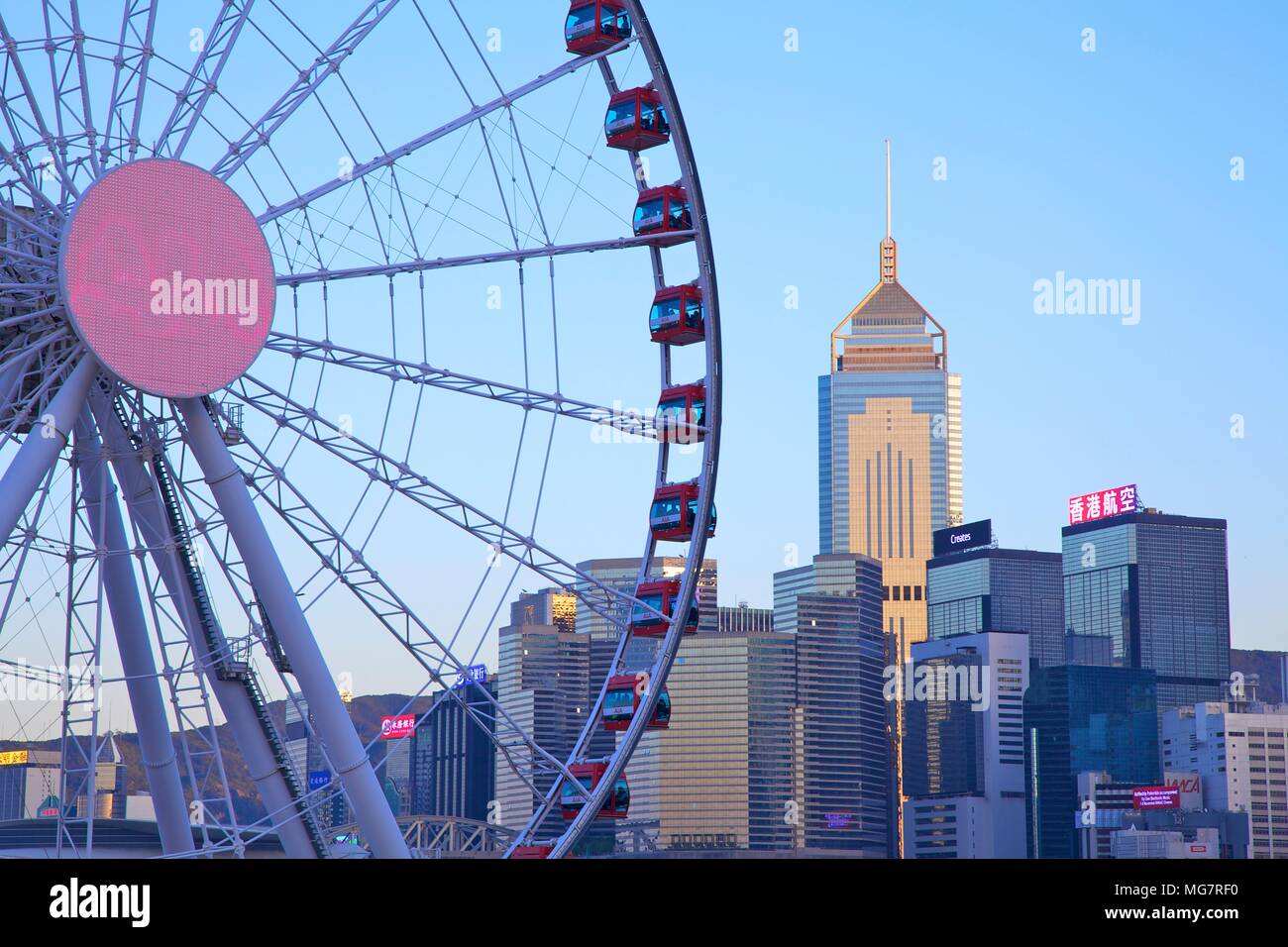 Hong Kong Cityscape With The Hong Kong Observation Wheel At Dusk, Hong Kong, China, South East Asia Stock Photo