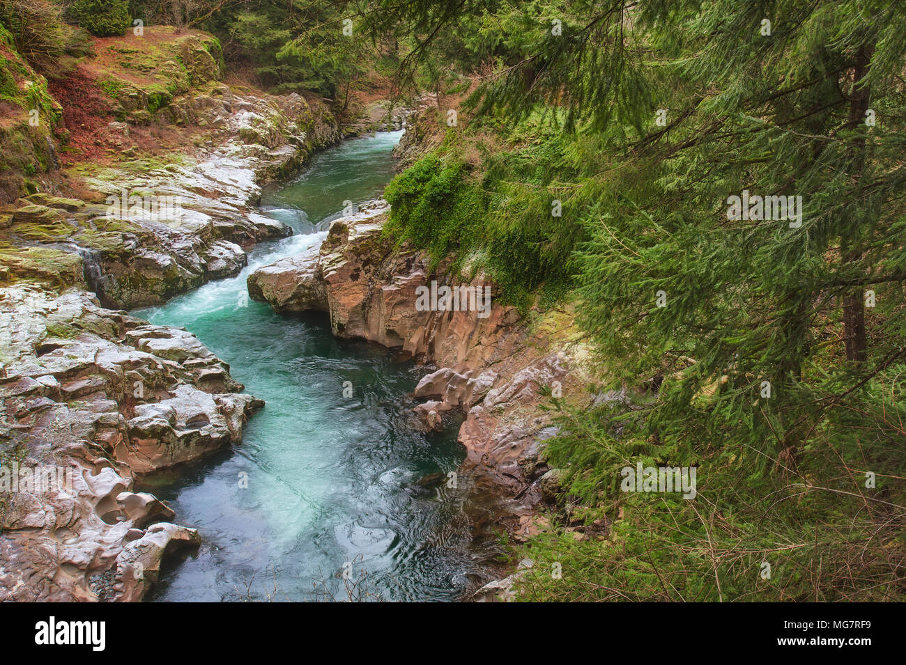 East Fork of the Lewis River in Clark County, Washington, seen from a bridge, with a light dusting of snow on a frosty winter morning Stock Photo