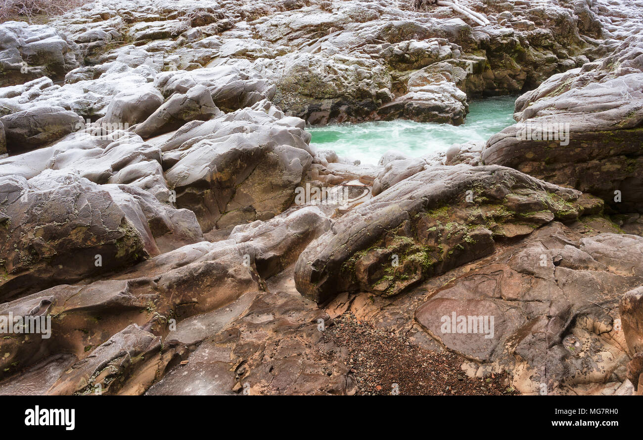 Boulders along the crevice carved by the water of the Lewis River. Stock Photo