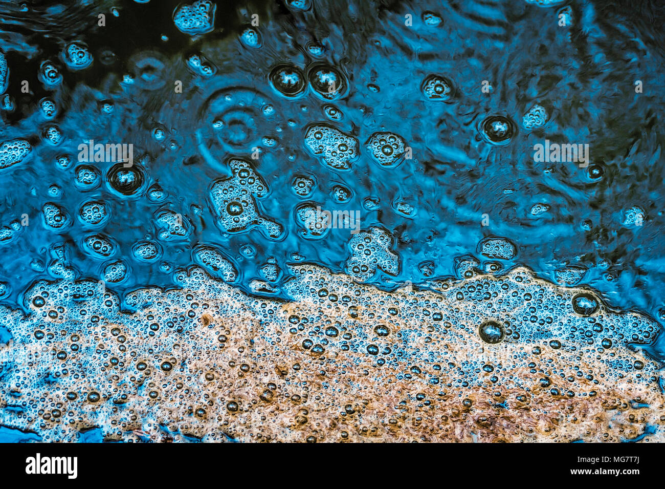 Raindrops on puddle hi-res stock photography and images - Alamy