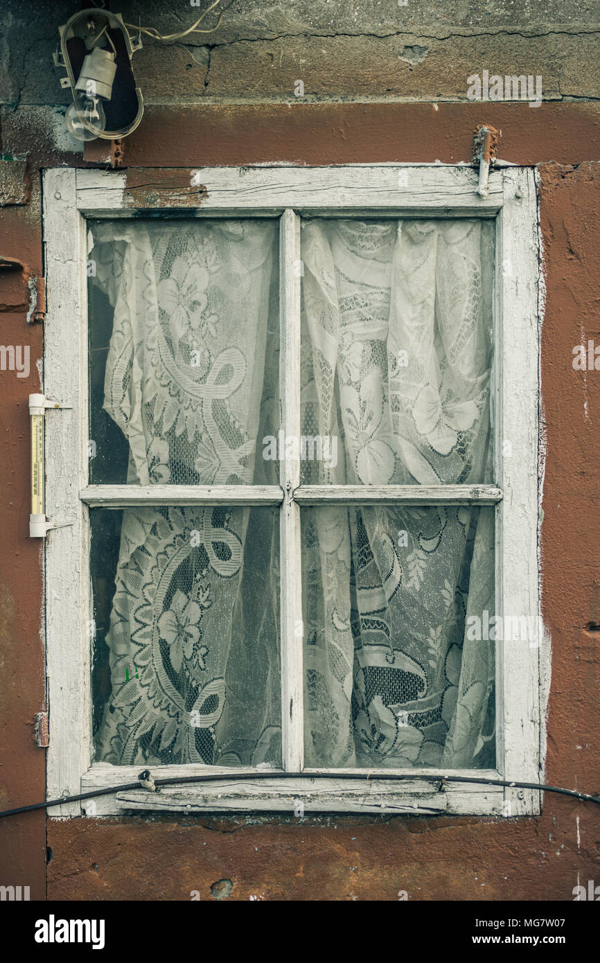 Window with curtain in an old building Stock Photo