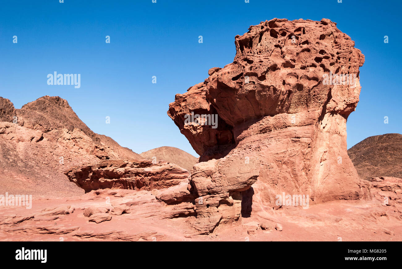 red sandstone rock formation called the Mushroom and a Half in Timna