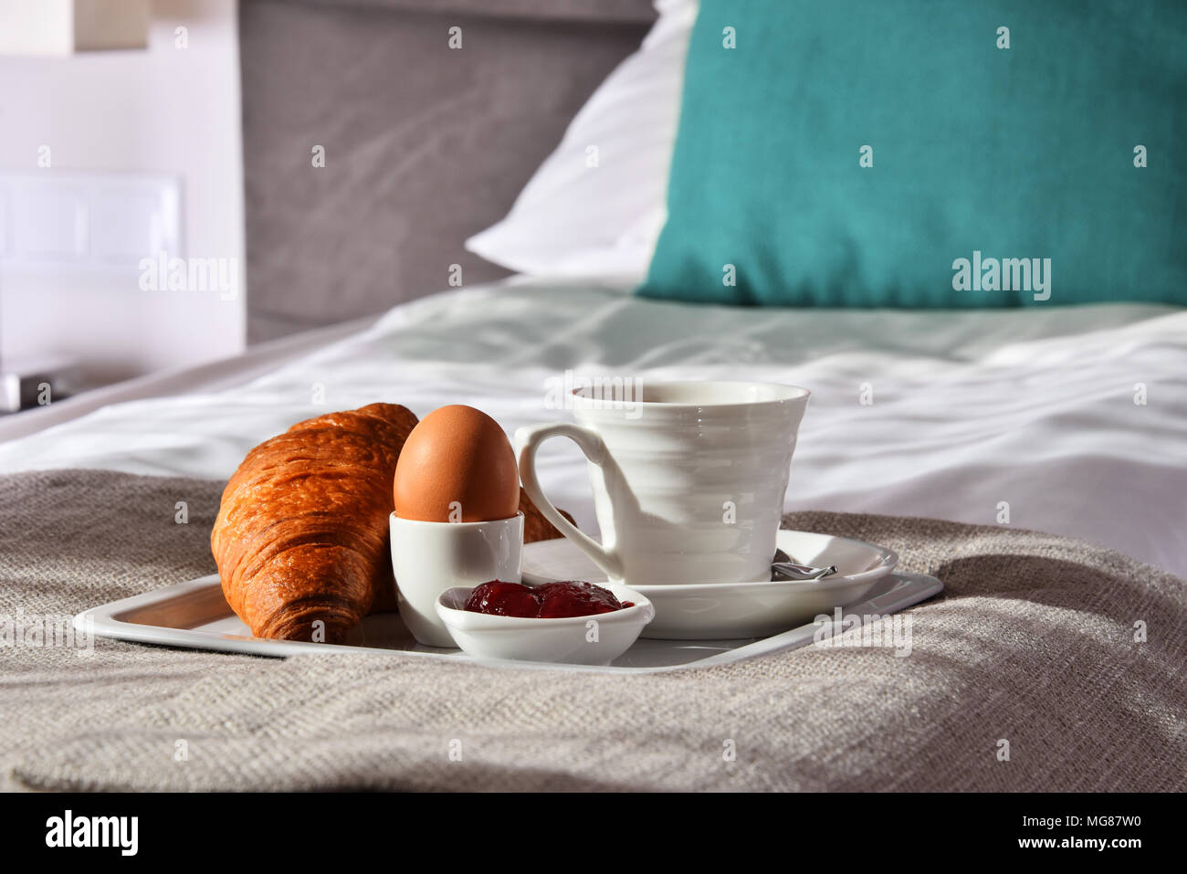 Breakfast on tray in bed in hotel room Stock Photo - Alamy