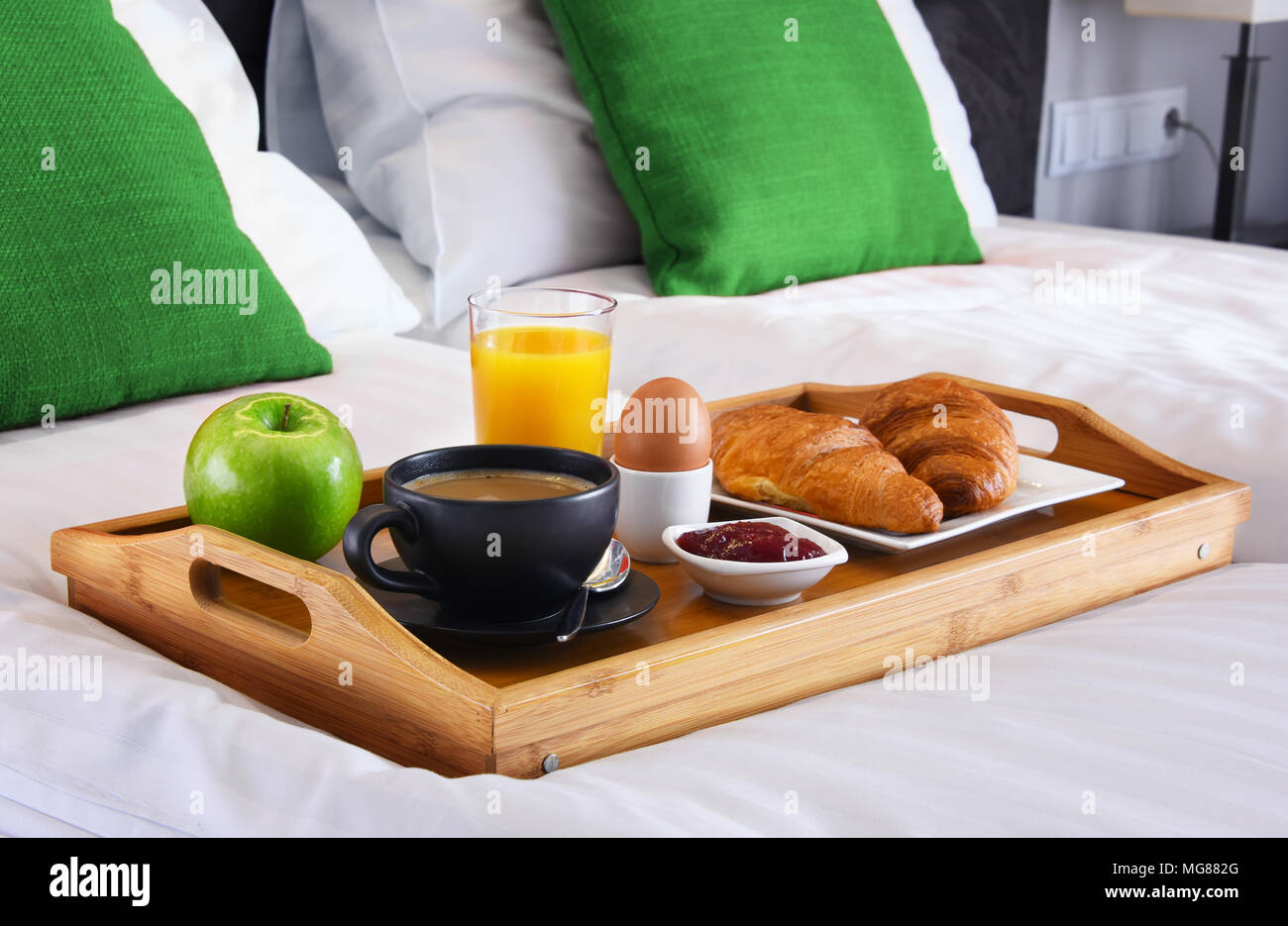 Breakfast on tray in bed in hotel room Stock Photo - Alamy
