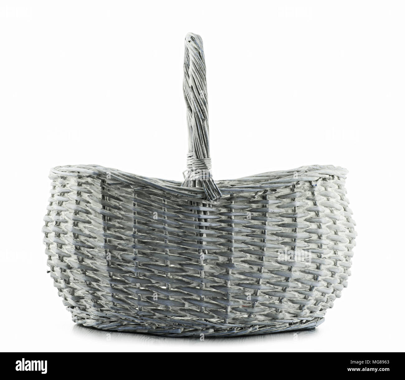 Empty wicker basket isolated on white background. Stock Photo