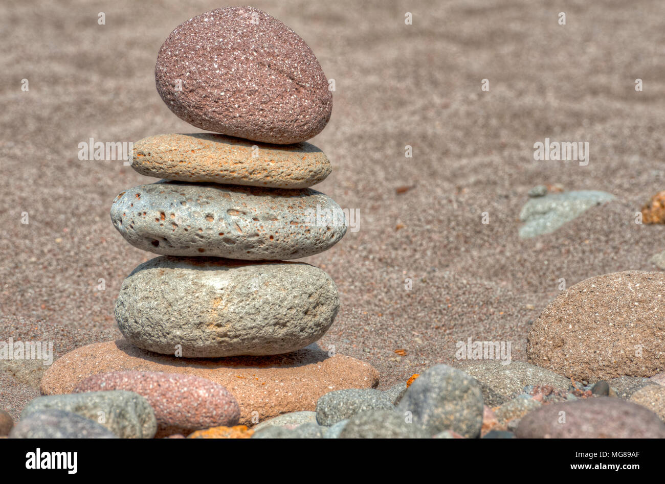 At Oxbow Park, along the Sandy River, has a beach where rocks are staked by anyone who visits the area creating a village of stacked rocks. Stock Photo