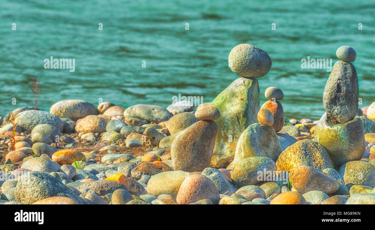 At Oxbow Park, along the Sandy River, has a beach where rocks are staked by anyone who visits the area creating a village of stacked rocks. Stock Photo