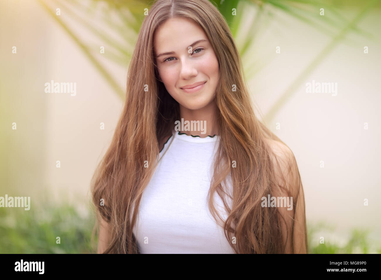 Portrait Of A Cute Teenage Girl Outdoors Over Natural Background