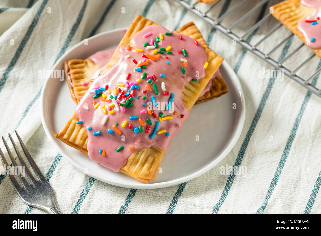 Sweet Homemade Strawberry Toaster Pastries with Sprinkles Stock Photo