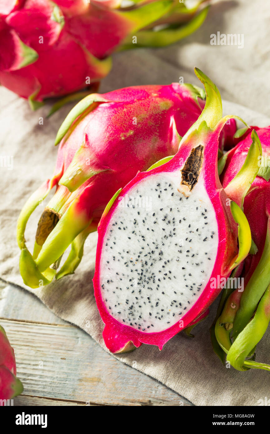 Raw Red Organic Dragon Fruit in a Bunch Stock Photo