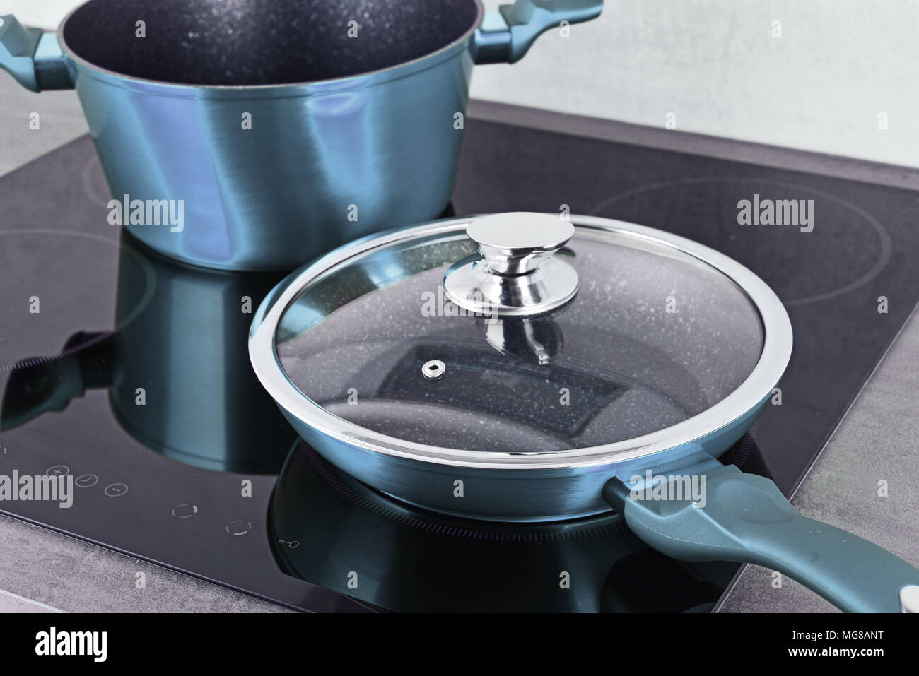 Frying Pan And Steel Pot On Modern Induction Cooktop Stock Photo