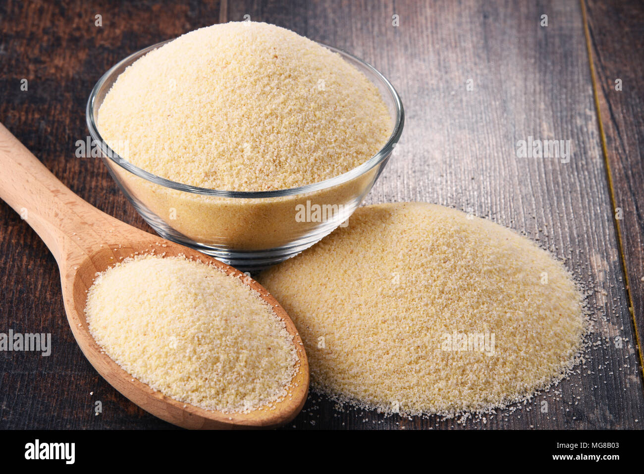 Bowl of semolina on wooden table Stock Photo - Alamy