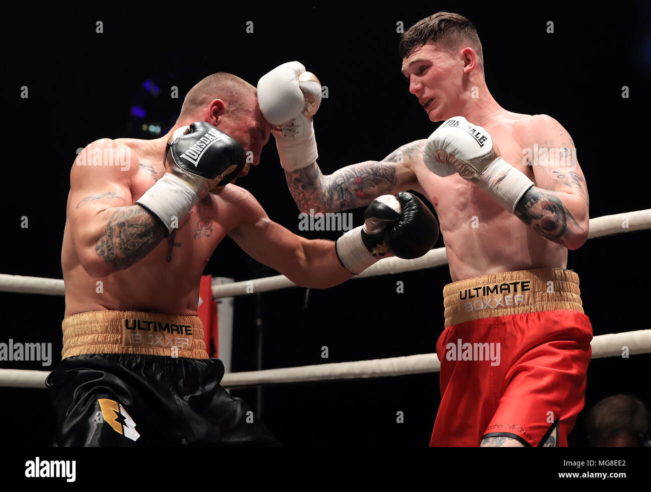 Drew Brown (right) and Sam Evans compete in Semi Final 1 of the Ultimate Boxxer competition at the M.E.N. Arena, Manchester. Stock Photo