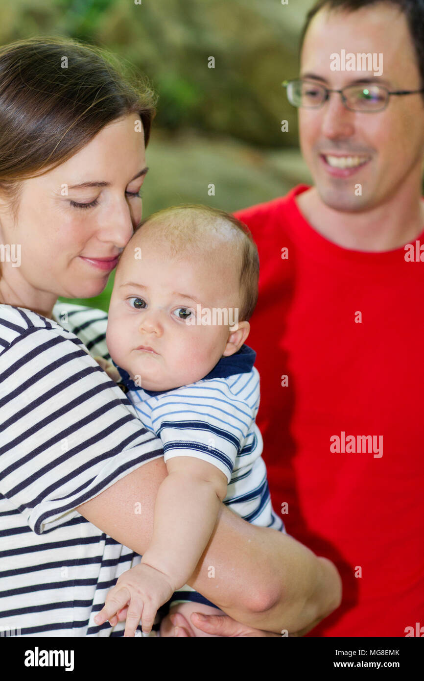 Husband and wife with their baby Stock Photo Alamy