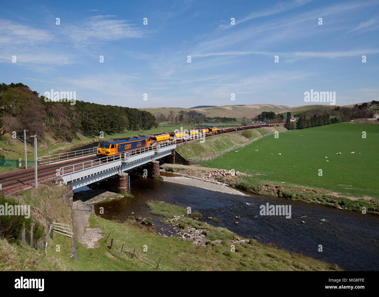 A GB Railfreight class 92 electric locomotive at  Crawford (River Clyde) hauling a freight train conveying materials for Network Rail Stock Photo