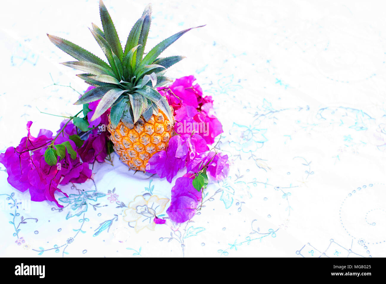 Pineapple and bougainvillea flowers Stock Photo