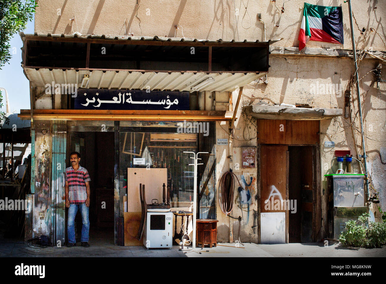 Repair man in his workshop, Kuwait Stock Photo