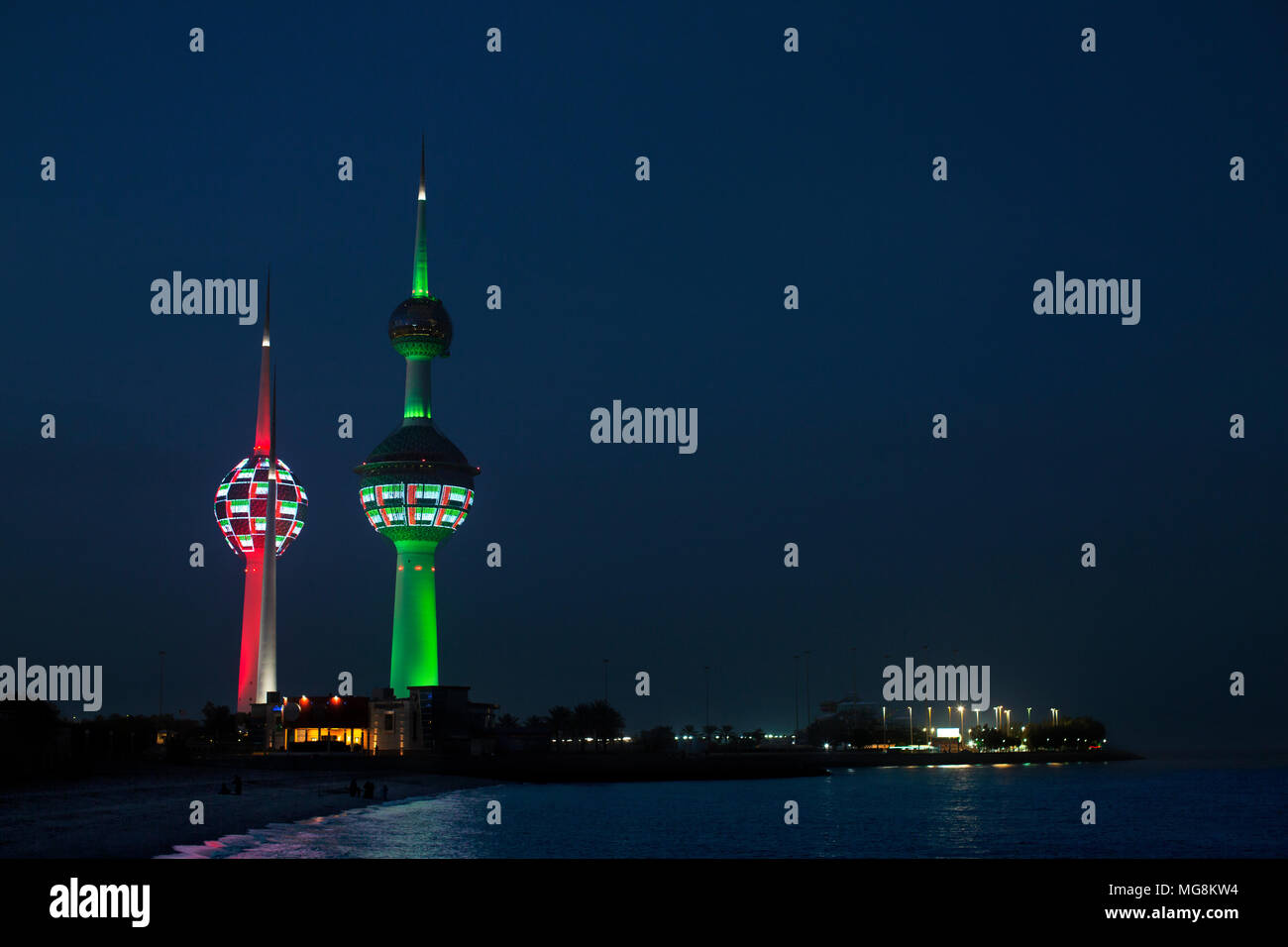 Kuwait towers lit up at night with the Kuwaiti colours. Kuwait City, Kuwait Stock Photo