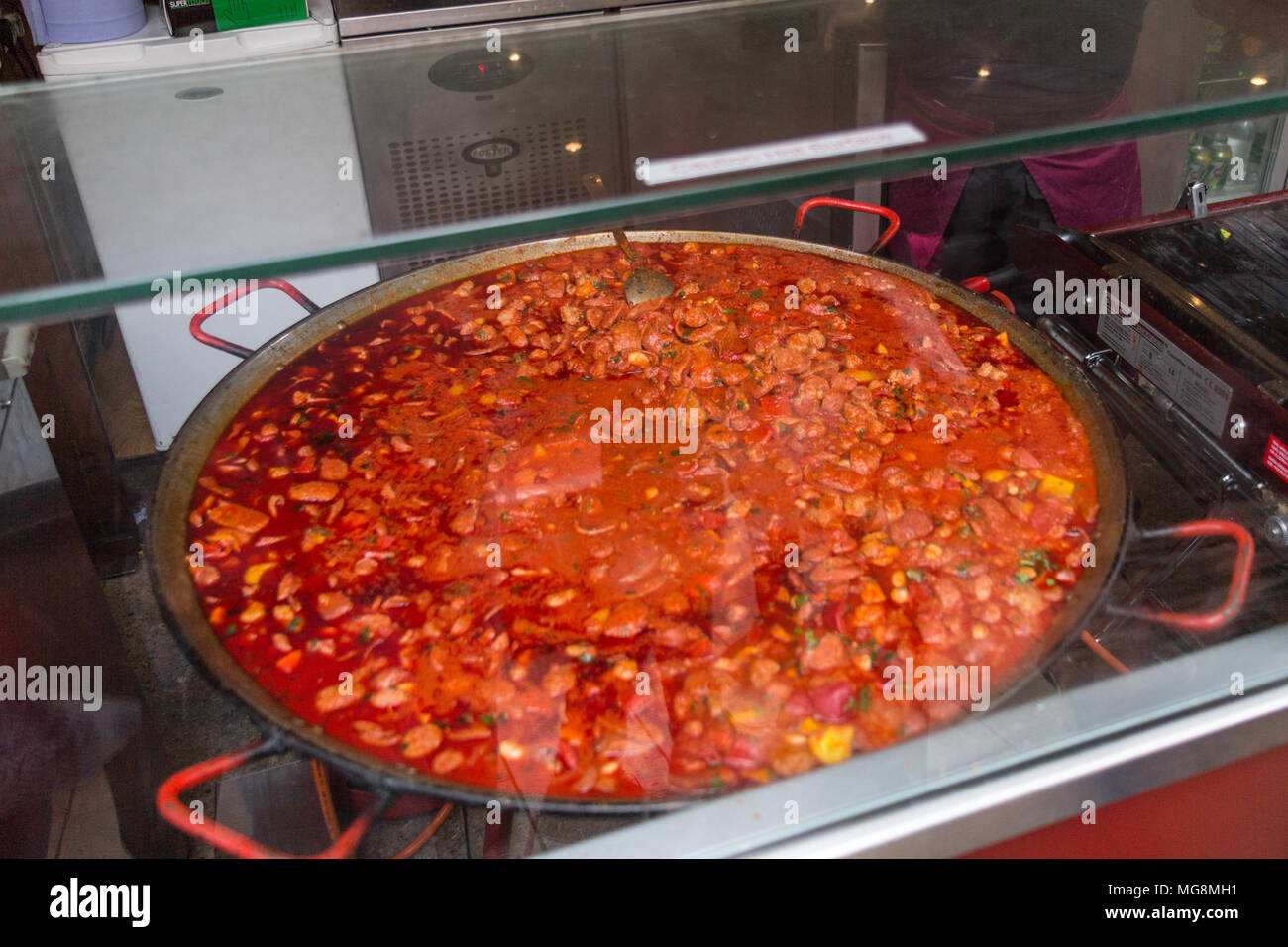 London, United Kingdom - May 2, 2015: An urn of hot food waiting to be served on a street vendor's stall in Borough Market. Stock Photo
