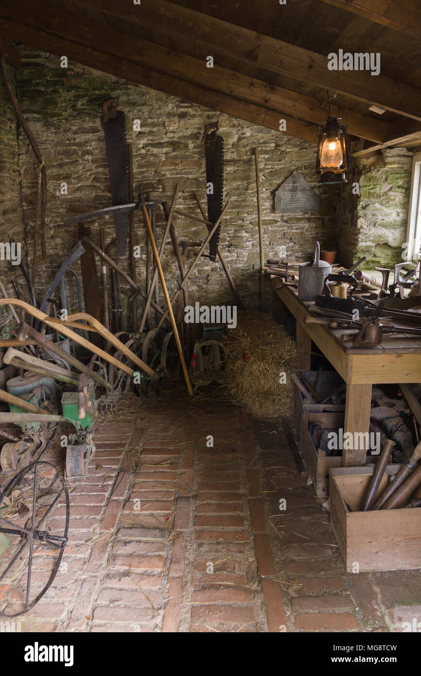 The gardener's tool shed with a multitude of equipment in the Lost Gardens of Heligan Cornwall Stock Photo