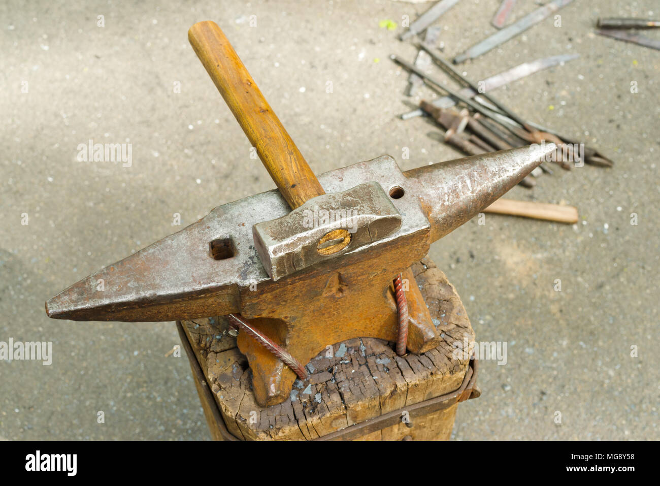 The hammer and anvil stand Stock Photo Alamy