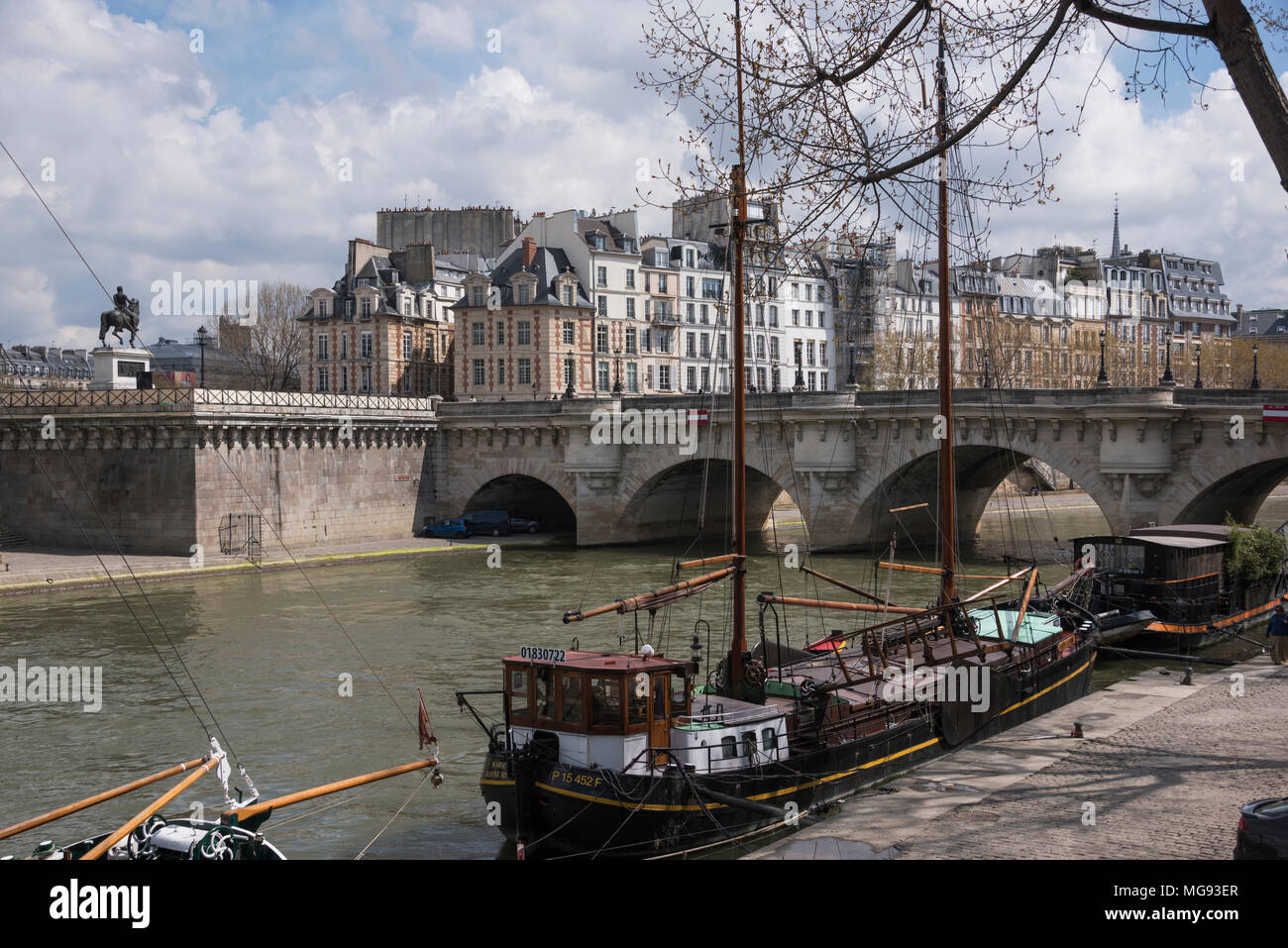 Sailing barges moored by the Pont Neuf, Paris, France Stock Photo