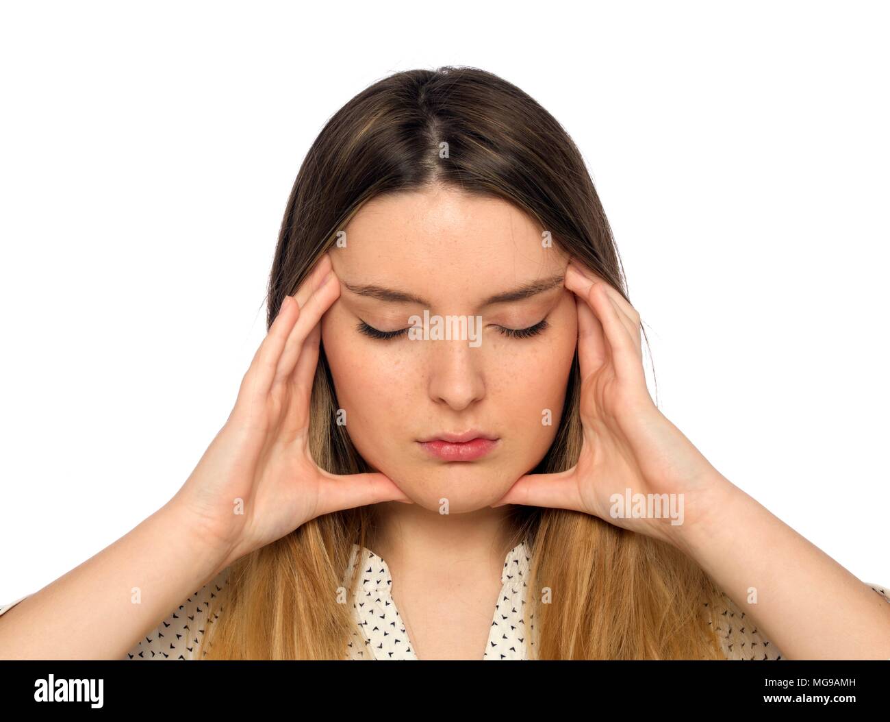 Young woman with hands touching face. Stock Photo